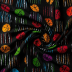 Colorful fabric pattern with circular and linear designs on a black background